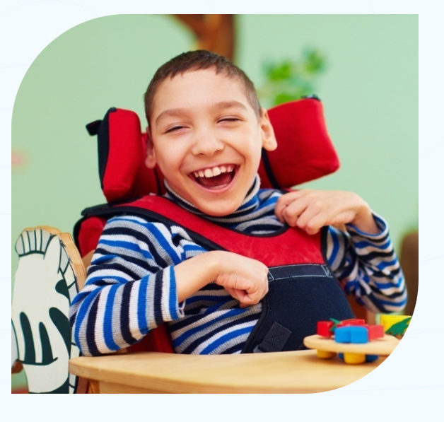 Happy child with special needs receiving dental care at ManDent